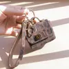 Llavero de Bolso Retro Francés Pu Estampado Leopardo Bolso Mini Portátil Moda Colgante Cabeza de Bolso Bolso para Auriculares Billetera