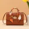 Bufanda de seda con rayas de diamante candado redondo bolso cuadrado pequeño 2026 estilo coreano bolso de mano pequeño comercio exterior al por mayor bolso de moda moderno