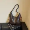 Bolso de hombro vintage nuevo transfronterizo 2026, bolso de mano de nicho de gran capacidad, bolso cruzado simple y elegante para el día a día