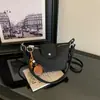 Bolsa de tecido simples para mulheres, nova coleção de verão 2026, bolsa de ombro, bolsa transversal, bolsa de mão, estilo coreano, adequada para o dia a dia, com design sofisticado e elegante, lembrando um bolinho delicado
