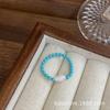 Chen Mo Diseño de Nicho de Personalidad Perla de Mariposa Blanca Natural Anillo Elástico con Perlas de Pino Verde Sintético Anillo Europeo y Americano para Mujer