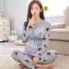 Pijama nuevo de manga larga para mujer primavera, otoño e invierno caricatura lindo rojo en línea se puede usar fuera del traje lote de fábrica de una generación de cabello
