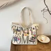 Bolsa de Lona 2025 Nuevo Estilo Letra Dibujos Animados Graffiti Tote Bolsa de Compras Versátil Hombro Viajero Gran Capacidad Bolsa Tote