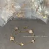 Marca de Luxo High-End Pulseira de Trevo de Quatro Folhas Redondo em Forma de Diamante, Flor de Quatro Pétalas, Flor de Cinco Pétalas para Mulheres, Madrepérola Branca, Madrepérola Rosa, Modelo Popular, Vendas Diretas por Transmissão ao Vivo