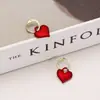 Corea del Sur Dongdaemun elegante celebridad de internet nicho diseño todo-partido hebilla de oreja femenina estilo coreano nuevo Pendientes de amor rojo femenino