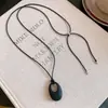 Collar minimalista de cordón de cuero estilo coreano con colgante ovalado, diseño único, cadena versátil para suéter, gargantilla diaria para mujeres
