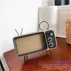 Soporte para Teléfono Móvil TV Retro Soporte para Teléfono Móvil de Escritorio Altavoz Retro Dientes PTH800 Regalo Creativo