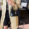Bolso de mujer de alta gama, diseño de bloques de color, de nicho, modelo nuevo 2025, bolso de mano versátil para el día a día, bolso de moda tipo dumpling