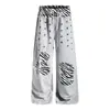 Calça de moletom longa casual larga com estampa de zebra retrô americana em retalhos e cós de estrela para homens e mulheres, outono de 2026