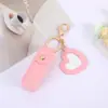 Mini Llavero Portátil de Lipstick Bolsa Redonda de Cuero con Espejo de Maquillaje Colgante para Bolso de Mano de Mujer