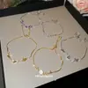 Colgante de Flor Hueca Ovalada de Corazón de Zircón Pulsera Deslizante Pulsera de Lujo Ligero de Gama Alta Pulsera de Moda Versátil