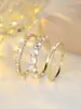 Conjunto de Anel de Três Peças Dourado Redondo com Diamante Branco para Mulheres Acessível de Luxo Transfronteiriço Europeu e Americano Anel Versátil de Dedo Indicador Nicho Ins