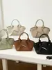 Bolso de mano transfronterizo para mujer 2026 nuevo de alta gama simple versátil plisado de hombro cruzado bolso cubo para ir al trabajo