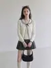 Moda de menina doce estilo coreano: cardigã de tricô preto com gola Peter Pan, gravata borboleta, mangas compridas, top feminino outono 2026, conjunto de duas peças