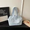 2026 Nova Bolsa de Ombro Única de Tecido Grande Capacidade Estilosa Estilo Coreano Bolsa Tote para o Trabalho Bolsa de Axila Fresca Fashionável Tendência