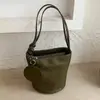 Bolso cubo tejido de nicho casual estilo coreano para mujer, nuevo bolso de hombro de moda, bolso de hombro y cruzado para commuting
