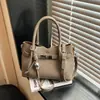 Bolso de Mano Pequeño Versátil Casual para Mujer 2026 Nuevo Invierno Bolso Cubo Simple Textura de Alta Calidad Bolso Cruzado para el Trabajo