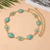 Corrente de cintura vintage turquesa mais vendida da Amazon para mulheres, combinada com saias, apresentando um design oval de gota d'água, cinto de corrente de metal para barriga