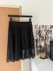 Falda plisada exquisitamente confeccionada, transparente y dinámica + top de punto Tencel negro con efecto adelgazante, mangas cortas elegantes, talla única, con etiquetas