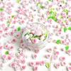 Venta al por mayor nuevo color melocotón polvo joyería para uñas resina flor lazo perla diamante plano paquete de materiales