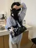 Diseño de alta calidad estilo chica picante bolso tote con hebilla para mujer 2026 nuevo bolso versátil de un solo hombro cruzado para la ciudad
