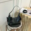 Nova Bolsa Transversal de Ombro Único para Mulheres Verão 2026 Bolsa de Axila Alta Aparência Commute Elegante Casual Bolsa Tote