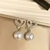 Pendientes de botón de corazón con incrustaciones de pedrería plateada y encaje retro, estilo chino, versátiles, joyería para orejas de lujo ligero y alta gama.