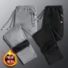 Pantalones deportivos de invierno para niños y adolescentes, pantalones de chándal de color sólido, con forro polar engrosado, para estudiantes de secundaria, casuales, combinables con todo, pantalones de moda para otoño e invierno