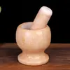 Atacado de Fábrica socador de alho de mármore natural moedor prensa de alho almofariz de alho doméstico almofariz de pedra pote de socar manual rolante