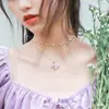 Collar de mariposa de cristal morado suave de lujo ligero de estilo japonés y coreano, cadena de clavícula de doble capa de perlas con temperamento de hada
