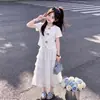 Verano 2026 Nuevo Dulce Floral Manga Corta Moda Femenina Estilo Suave Ribete de Encaje Falda Pastel Conjunto de Dos Piezas