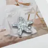 Hebilla decorativa de metal con forma de estrella de mar, estilo europeo y americano transfronterizo, conector de tirante para traje de baño de alta gama, hebilla para bufanda, hebilla de ajuste para cinturón