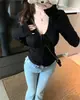Toma real: Suéter de punto puro y seductor con cuello en V, corbata de lazo, cordón y diseño calado, jersey de manga larga para principios de otoño para mujer 19070