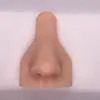 Modelo de rasgos faciales humanos perforado con punzón modelo de oreja de silicona nariz lengua ombligo ojos boca rasgos faciales humanos