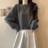 Suéter suave y acogedor de cuello redondo para mujer, nuevo estilo otoño e invierno, corte holgado casual, jersey adelgazante, top corto de punto de manga larga para mujer