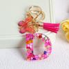 Llavero con borla de mariposa de 26 letras con pegamento de piedra de cristal y 26 letras de Creative Europe y Estados Unidos, joyería colgante.