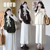 Vestido de Punto de Cuello Alto Medio Reductor de Edad para Maternidad Otoño/Invierno 2026 + Conjunto de Punto para Maternidad con Chaleco de Punto y Lazo Francés