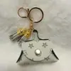 La mejor opción de regalo para mujeres: Bolsa pequeña para monedas de cuero PU de otoño e invierno, bolsa para auriculares, llavero, en stock para entrega rápida, perfecta para el Día del Maestro