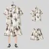 Camisa floral de manga corta, Ropa de playa de Hainan, Estilo hawaiano de Sanya, Conjunto de pantalones cortos finos de verano para hombre y pareja de viaje a Tailandia