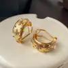 Brincos de Trevo de Quatro Folhas Vazados Novo Estilo Popular de 2026 Brincos de Alto Padrão Estilo Francês Metal Escovado Ear Clips de Estrela de Luxo Leve