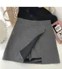 Falda de traje para mujer 2024 nuevo estilo de verano, falda ajustada a la cadera, pantalones de falda anti-exposición, cintura alta, abertura, falda corta de línea A a la moda