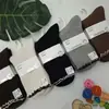 Calcetines de cachemir de doble puntada para hombre y mujer de invierno, calcetines de tubo de moda para mujer con rayas marrones y encaje, calcetines de algodón de cachemir hipoalergénicos para hombre de negocios