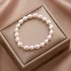 Pulsera de Perlas de Agua Dulce Arroz Temperamento Diseño de Nicho Moda Simple Pulsera Chapada en Oro de 18 Quilates Elástica Ajustable