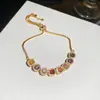 [Cadena de Diamantes Arcoíris] Pulsera de extracción de zircón trenzado en cruz, una pulsera lujosa y de alta gama, una pieza de joyería delicada y de moda