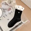 Calcetines Coreanos Dongdaemun Nuevos Primavera y Verano 2026 para Mujer con Lazo 3D, Calcetines a Media Pantorrilla con Etiquetas de Tela de Letras, Calcetines Holgados