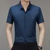 2024 Verano Nuevo Hombres Jóvenes y de Mediana Edad Cuello Solapa Negocios Estampado Sin Costuras Moda Casual Camisa de Manga Corta Cabello de Hombre
