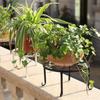Soporte de flores de hierro forjado de una sola capa para balcón exterior, plantas en maceta, cintas y almacenamiento interior.