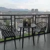 Juego pequeño de mesa y sillas redondas de acero al carbono simple para ocio en balcón, mesa de discusión, área de descanso, mesa de comedor para cafetería de té con leche al aire libre