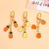 Llavero de Fruta de Aleación Creativo Manzana Caqui Naranja Colgante para Bolso Decoración para Mochila de Estudiante Colgante Pequeño Regalo