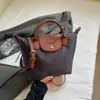 Bolsa de Ombro Único Transversal de Alta Gama Transfronteiriça para Nicho Moda Outono e Inverno 2025 Grande Capacidade Bolsa Dumpling Bolsa Tote